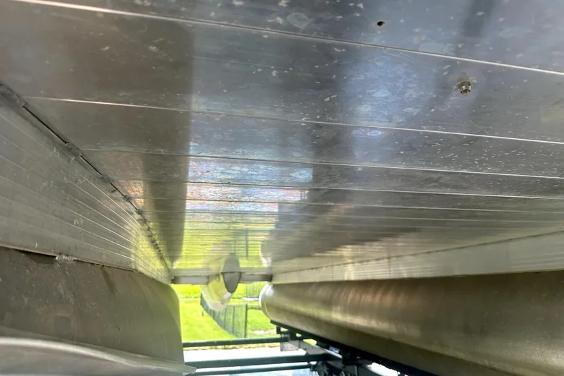 Slide: The Image of Underside view of 2021 Veranda Vista 22RC pontoon boat, showcasing aluminum construction. - 17