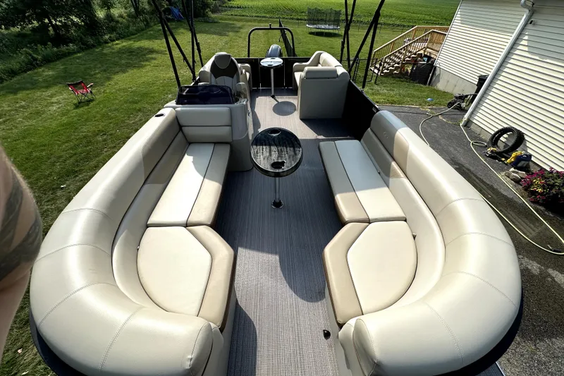 Slide: The Image of 2021 Veranda Vista 22RC pontoon boat with spacious seating and sleek design. - 24