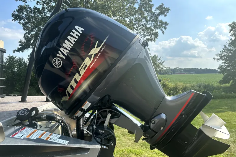 Slide: The Image of 2021 Veranda Vista 22RC with Yamaha VMAX outboard motor in a scenic outdoor setting. - 32