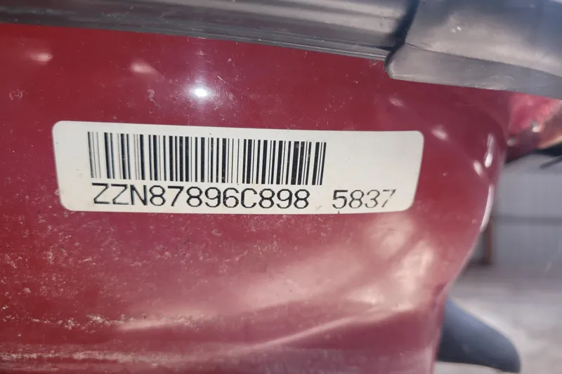 Slide: The Image of Barcode sticker on a 1998 SkiDoo GTX, displaying serial number ZZN87896C898 5837. - 5
