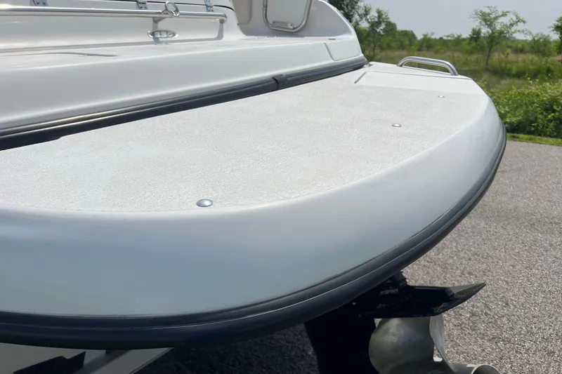 Slide: The Image of 2003 Crownline 230 BR boat stern view with swim platform and propeller. - 17