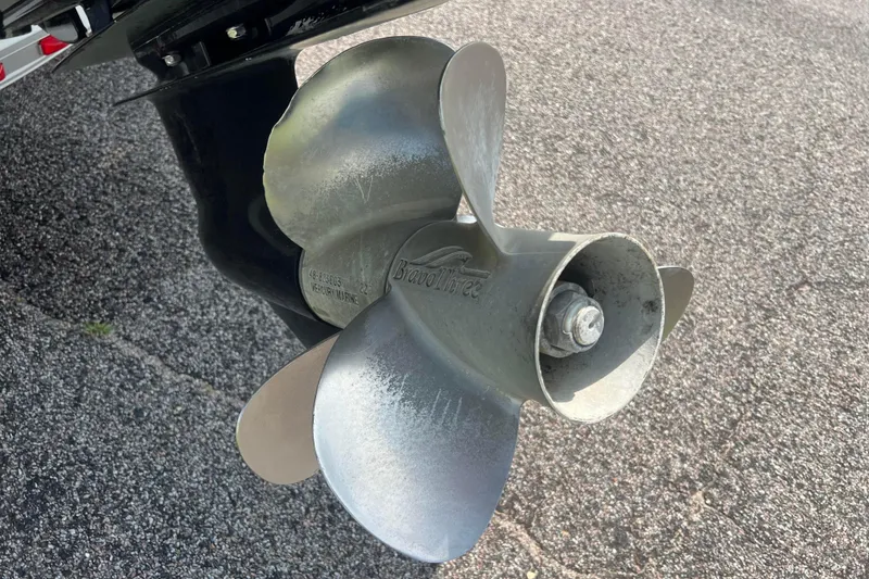 Slide: The Image of Propeller of 2003 Crownline 230 BR boat on asphalt surface. - 18