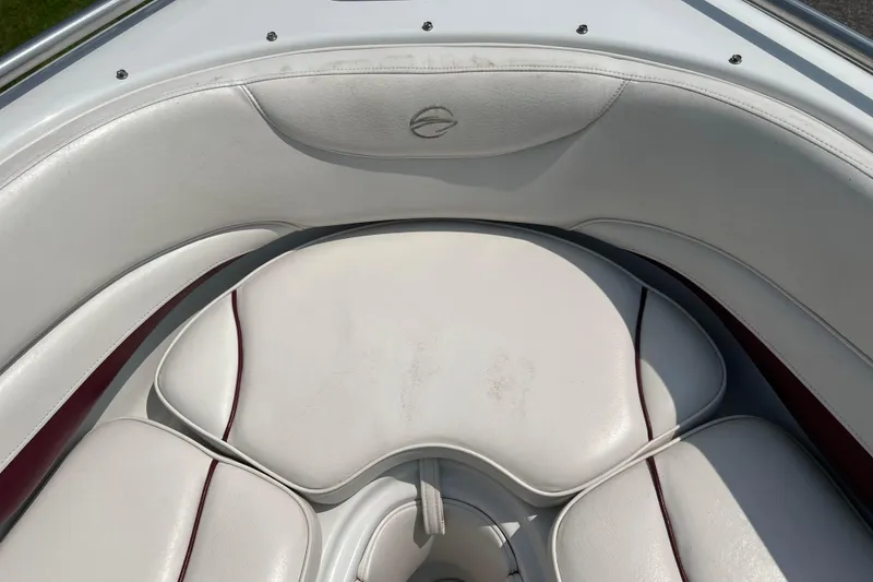 Slide: The Image of 2003 Crownline 230 BR boat interior with white leather seating and red accents. - 51