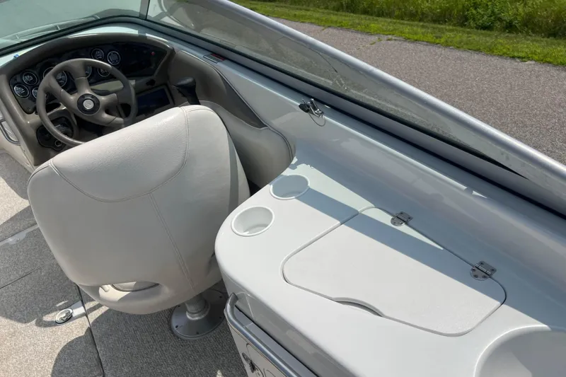 Slide: The Image of 2003 Crownline 230 BR boat interior with steering wheel and dashboard. - 66