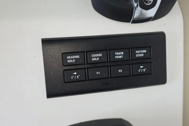 Slide: The Image of Control panel of 2024 Pursuit DC 326 Dual Console with Yamaha navigation buttons. - 17