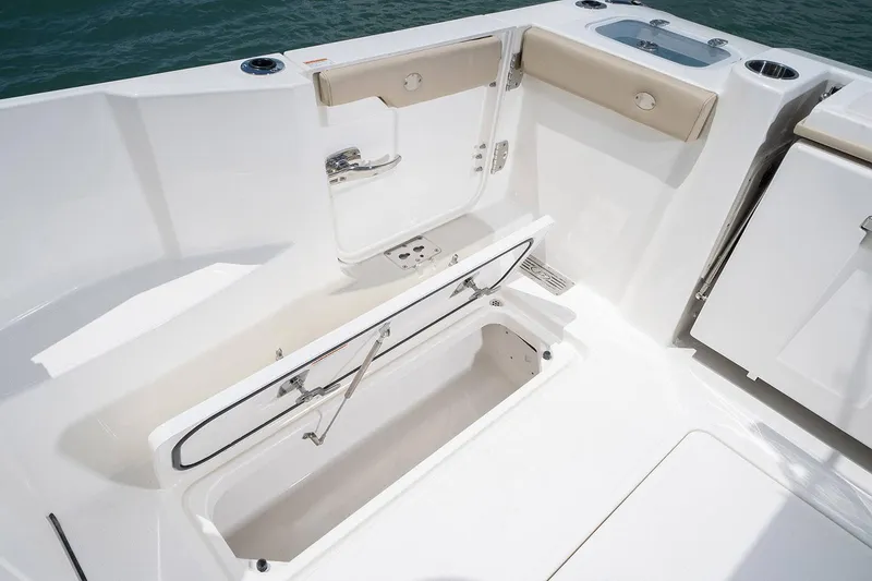 Slide: The Image of Manufacturer Provided Image: 2024 Pursuit DC 326 Dual Console boat interior with storage compartment and seating. - 18