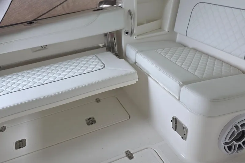 Slide: The Image of 2024 Pursuit DC 326 Dual Console boat interior with white quilted seating. - 22