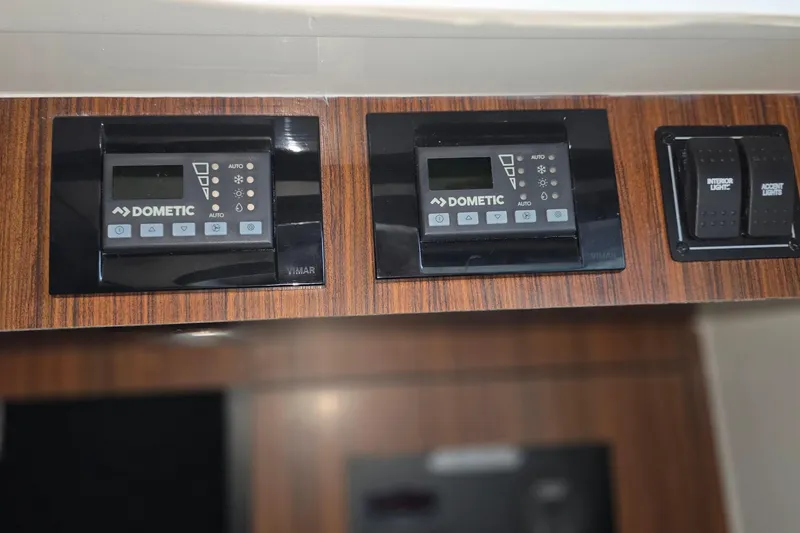 Slide: The Image of Control panel on 2024 Pursuit DC 326 Dual Console boat with Dometic systems. - 28