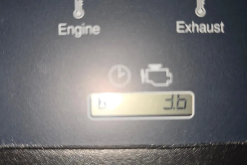 Slide: The Image of Close-up of a 2024 Pursuit DC 326 Dual Console engine display. - 36