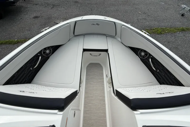 Slide: The Image of 2025 Sea Ray SPX 190 boat interior with sleek white seating and modern design. - 10