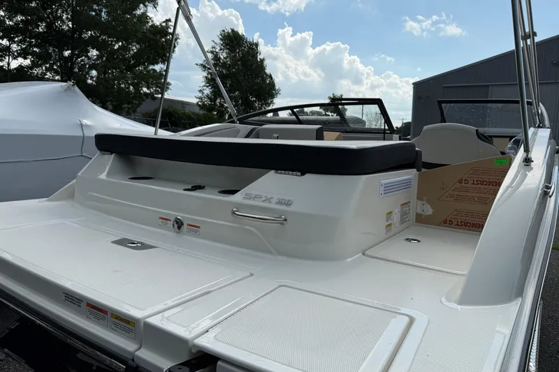 Slide: The Image of 2025 Sea Ray SPX 190 boat, rear view, showcasing sleek design and spacious deck. - 3
