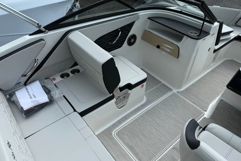 Slide: The Image of 2025 Sea Ray SPX 190 boat interior with sleek seating and modern design. - 5