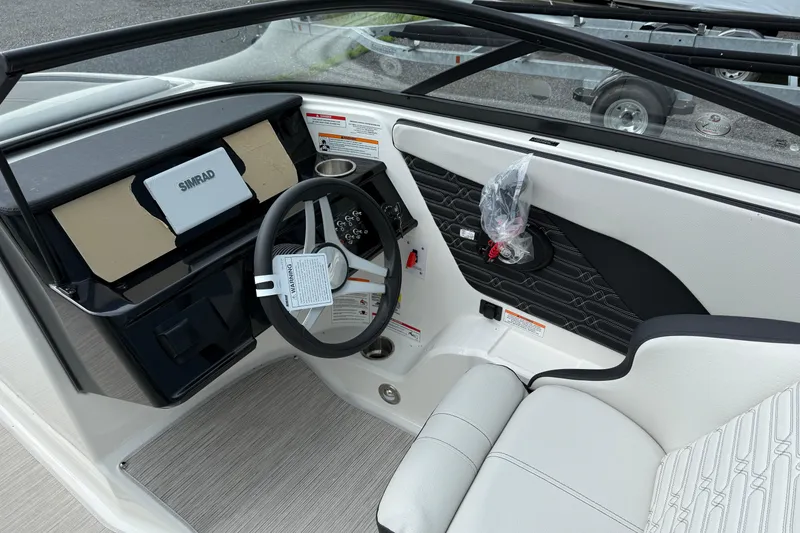 Slide: The Image of Interior of 2025 Sea Ray SPX 190 boat with steering wheel and dashboard. - 7
