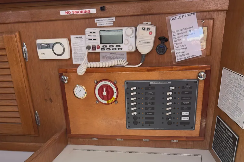 Slide: The Image of Control panel of a 1998 Catalina 36 MkII sailboat with various switches and equipment. - 11