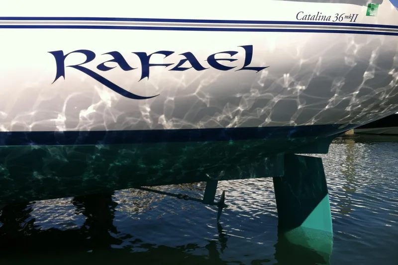 Slide: The Image of 1998 Catalina 36 MkII sailboat named "Rafael" reflecting on water. - 3