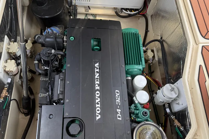 Slide: The Image of 2024 Ranger Tugs R31CB engine compartment featuring Volvo Penta D4-320 engine. - 14