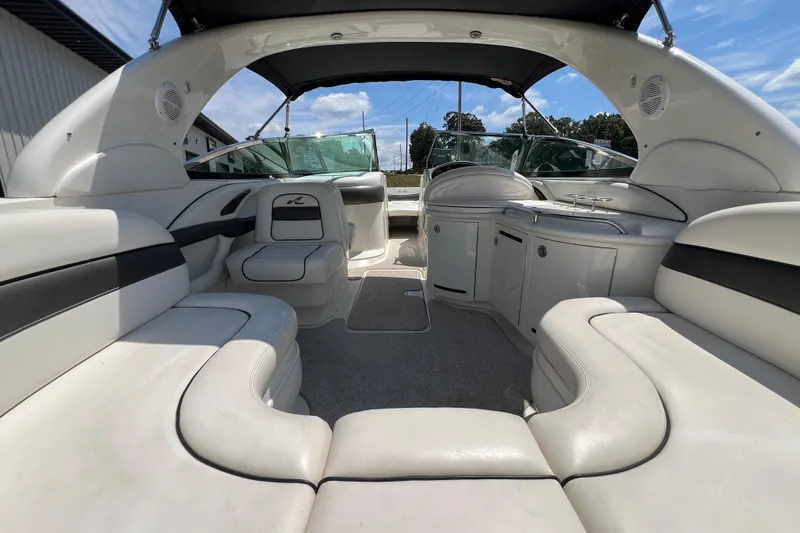 Slide: The Image of 2005 Sea Ray 290 SLX boat interior with spacious seating and sleek design. - 15
