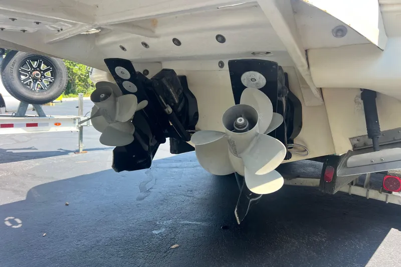 Slide: The Image of 2005 Sea Ray 290 SLX boat propellers and stern view on a trailer. - 22