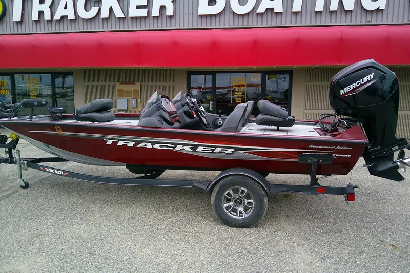 Slide: The Image of 2021 Tracker Pro Team 175 TXW Tournament Edition boat displayed outside dealership. - 2