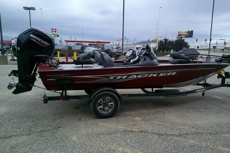 Slide: The Image of 2021 Tracker Pro Team 175 TXW Tournament Edition boat with Mercury engine on trailer. - 3