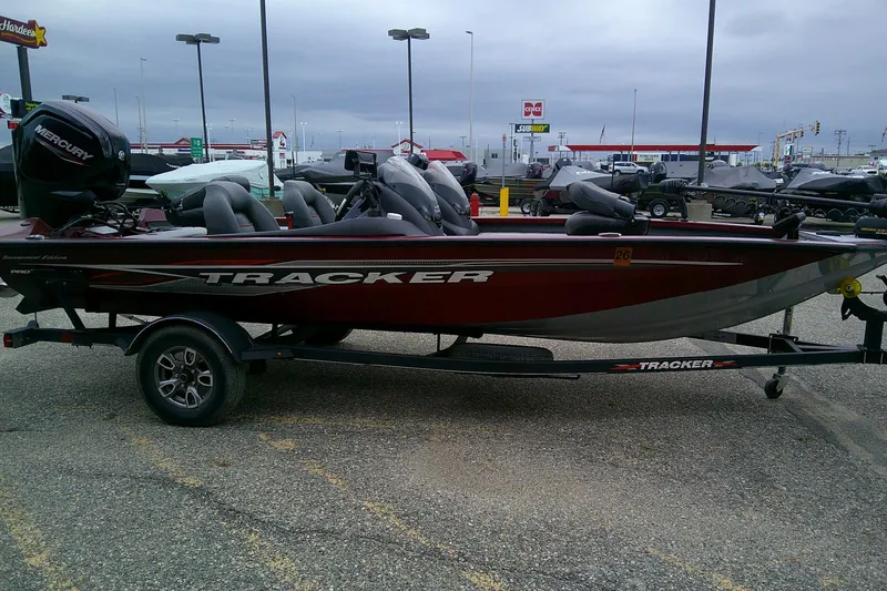 Slide: The Image of 2021 Tracker Pro Team 175 TXW Tournament Edition boat on trailer in parking lot. - 5
