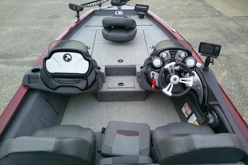 Slide: The Image of 2021 Tracker Pro Team 175 TXW Tournament Edition boat interior with steering console and seating. - 6