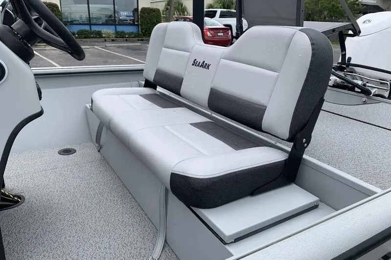Slide: The Image of 2026 SeaArk Shadow 18 Center Console boat interior with cushioned seating. - 10