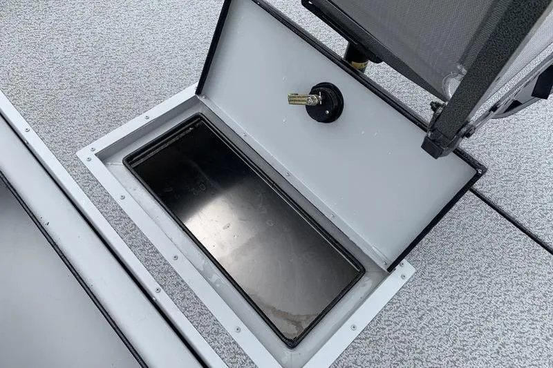 Slide: The Image of Open storage compartment on 2026 SeaArk Shadow 18 Center Console boat. - 12