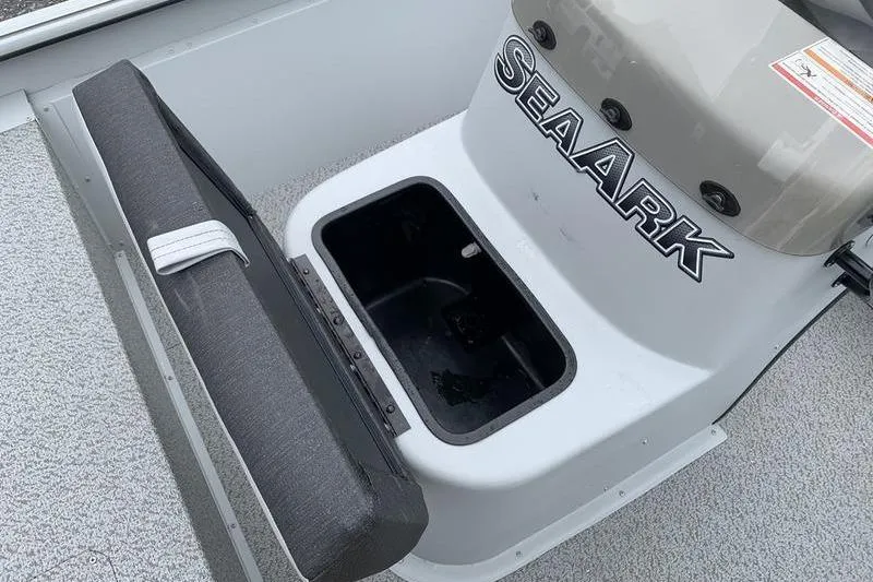 Slide: The Image of 2026 SeaArk Shadow 18 Center Console boat interior with storage compartment open. - 15