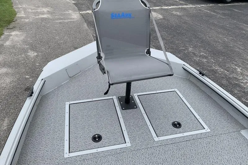 Slide: The Image of 2026 SeaArk Shadow 18 Center Console boat with a single seat on deck. - 16