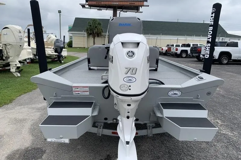 Slide: The Image of 2026 SeaArk Shadow 18 Center Console boat with Yamaha 70 engine, parked outdoors. - 3