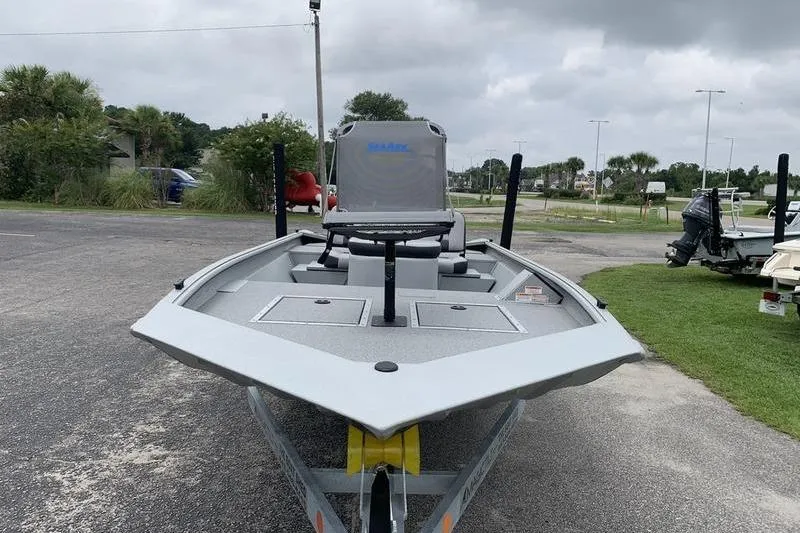 Slide: The Image of 2026 SeaArk Shadow 18 Center Console boat on trailer, parked outdoors. - 7