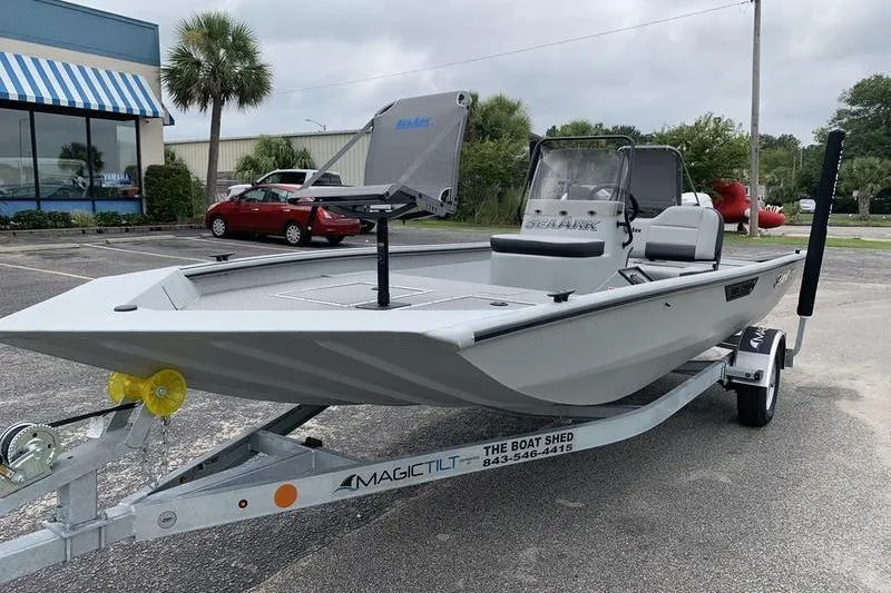 Slide: The Image of 2026 SeaArk Shadow 18 Center Console boat on trailer in parking lot. - 8