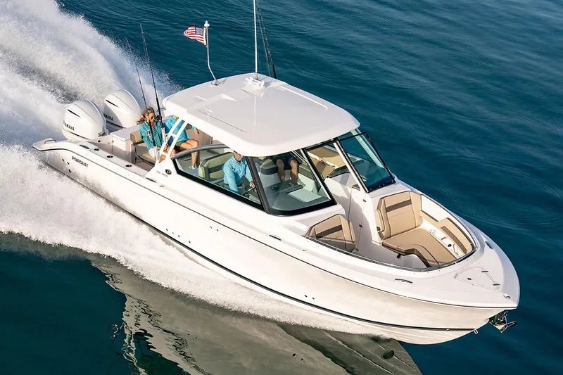 Slide: The Image of 2019 Pursuit DC 325 Dual Console boat cruising on water. - 94