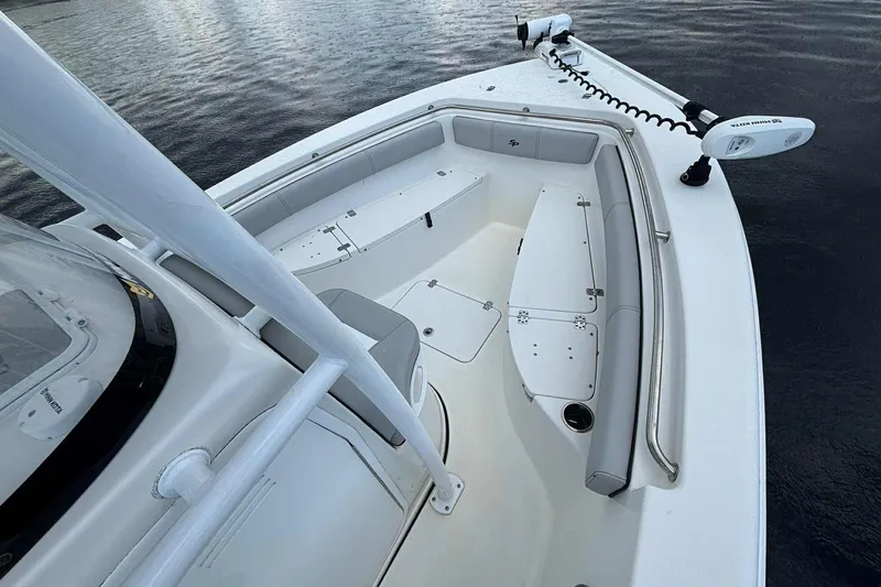 Slide: The Image of 2020 Sea Pro 219 Center Console boat interior with seating and storage compartments. - 10