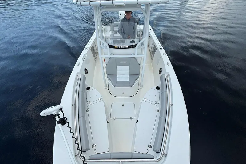 Slide: The Image of 2020 Sea Pro 219 Center Console boat on water, featuring spacious seating and modern design. - 11