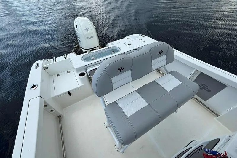 Slide: The Image of 2020 Sea Pro 219 Center Console boat with seating and Suzuki outboard motor on water. - 18