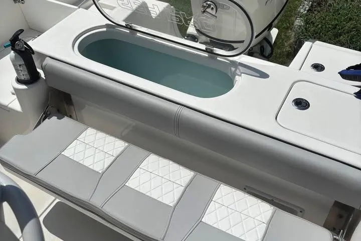 Slide: The Image of 2020 Sea Pro 219 Center Console boat interior with seating and livewell. - 24