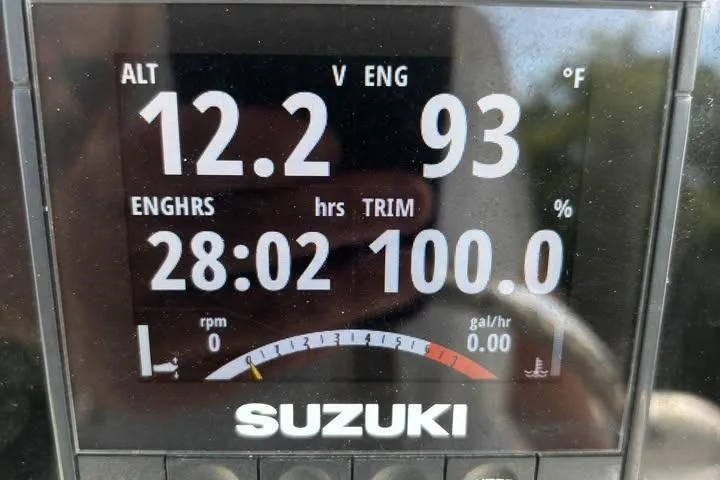 Slide: The Image of Digital display of Suzuki engine metrics on a 2020 Sea Pro 219 Center Console boat. - 26