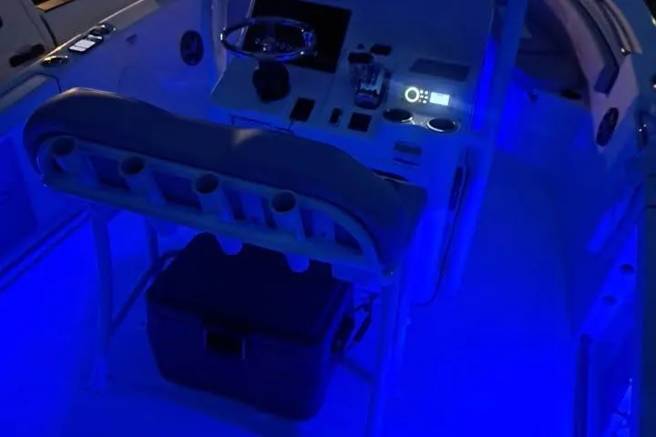 Slide: The Image of 2020 Sea Pro 219 Center Console boat interior with blue LED lighting. - 28
