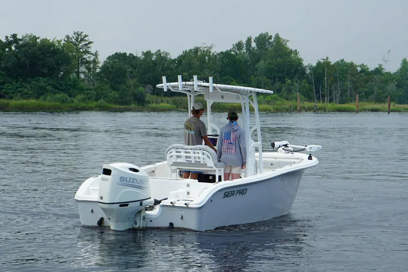 Slide: The Image of 2020 Sea Pro 219 Center Console boat on water with two people onboard. - 4