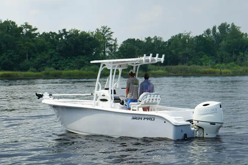 Slide: The Image of 2020 Sea Pro 219 Center Console boat on calm water with two people onboard. - 5