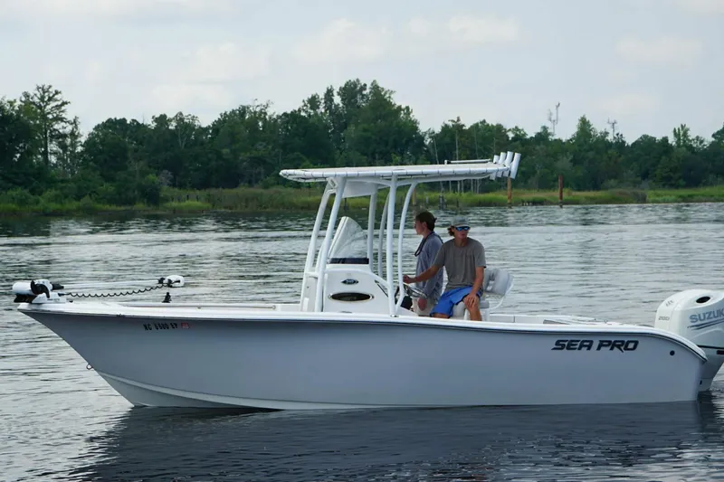 Slide: The Image of 2020 Sea Pro 219 Center Console boat on calm water with two people onboard. - 6