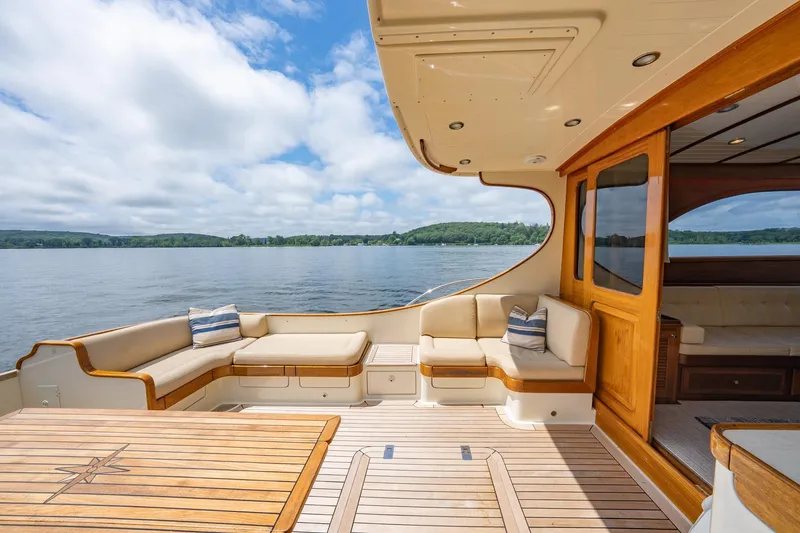 Slide: The Image of Luxurious 2007 Vicem 65 yacht deck with elegant seating and scenic water view. - 12