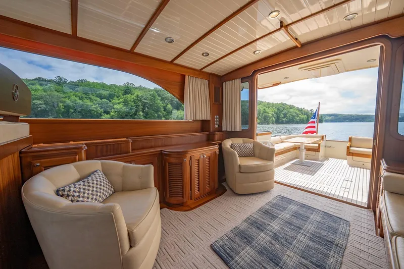 Slide: The Image of Luxurious 2007 Vicem 65 yacht interior with elegant seating and scenic lake view. - 14