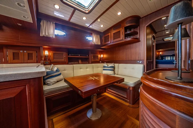 Slide: The Image of Luxurious 2007 Vicem 65 yacht interior with elegant wood finish and cozy seating area. - 21