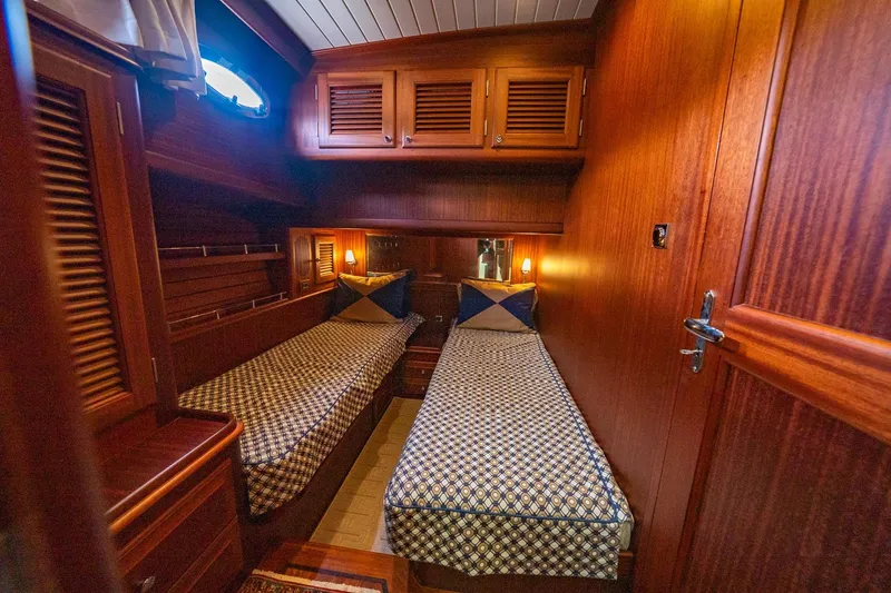 Slide: The Image of Luxurious 2007 Vicem 65 yacht cabin with twin beds and elegant wood finish. - 22