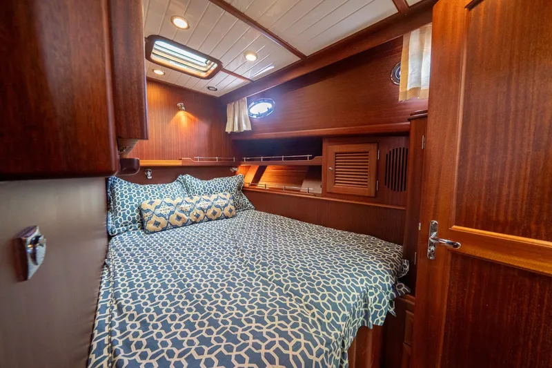 Slide: The Image of Luxurious cabin interior of 2007 Vicem 65 yacht with elegant wood finish and patterned bedding. - 23