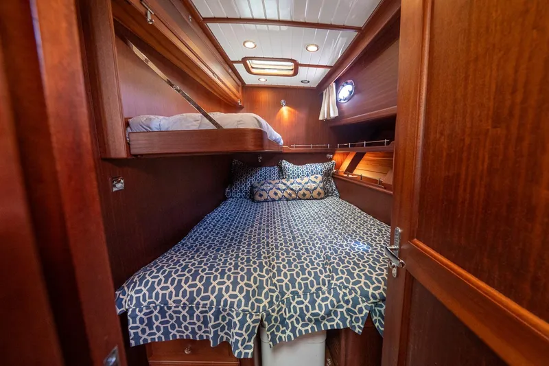 Slide: The Image of Luxurious cabin interior of 2007 Vicem 65 yacht with wooden finish and cozy bedding. - 24