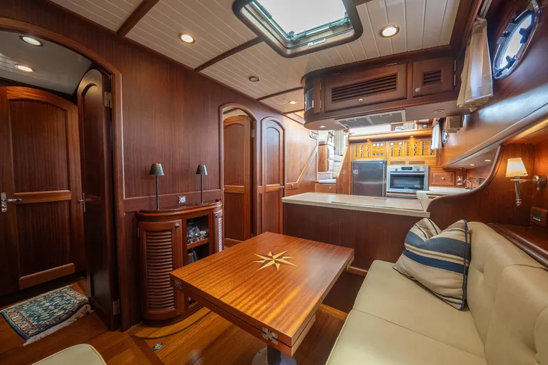 Slide: The Image of Luxurious 2007 Vicem 65 yacht interior with elegant wood finishes and modern kitchen amenities. - 27